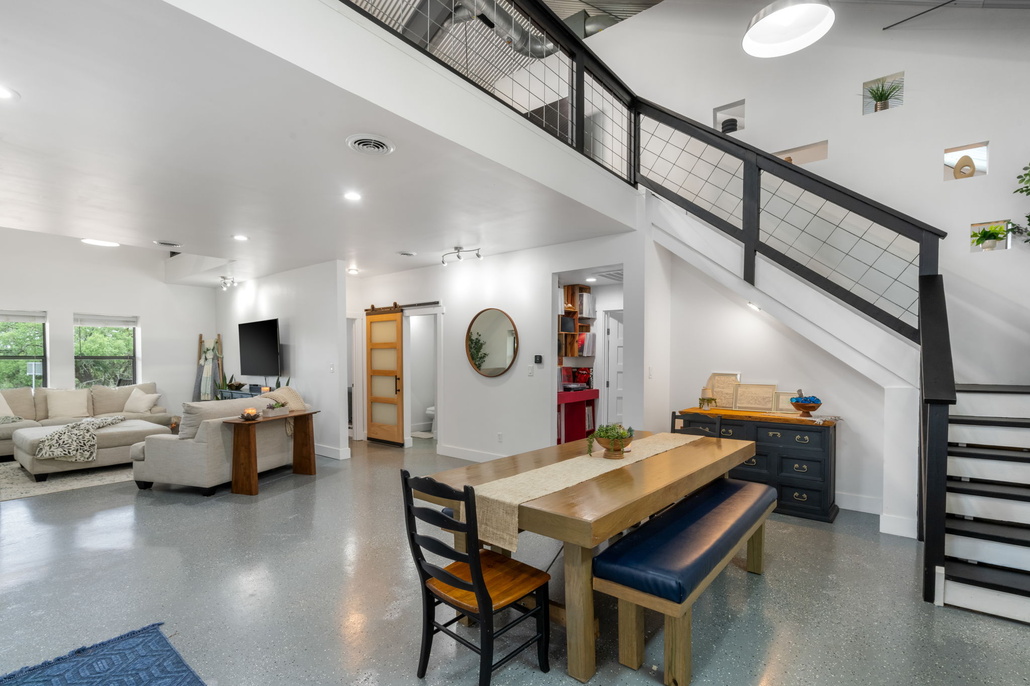 180 Henly Loop Dripping Springs, TX 78620 - Photo 15 of 38 a living room with furniture and wooden floor