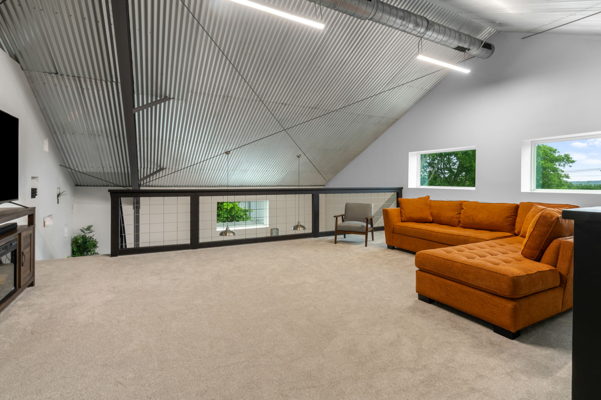 180 Henly Loop Dripping Springs, TX 78620 - Photo 24 of 38 a living room with furniture and a flat screen tv
