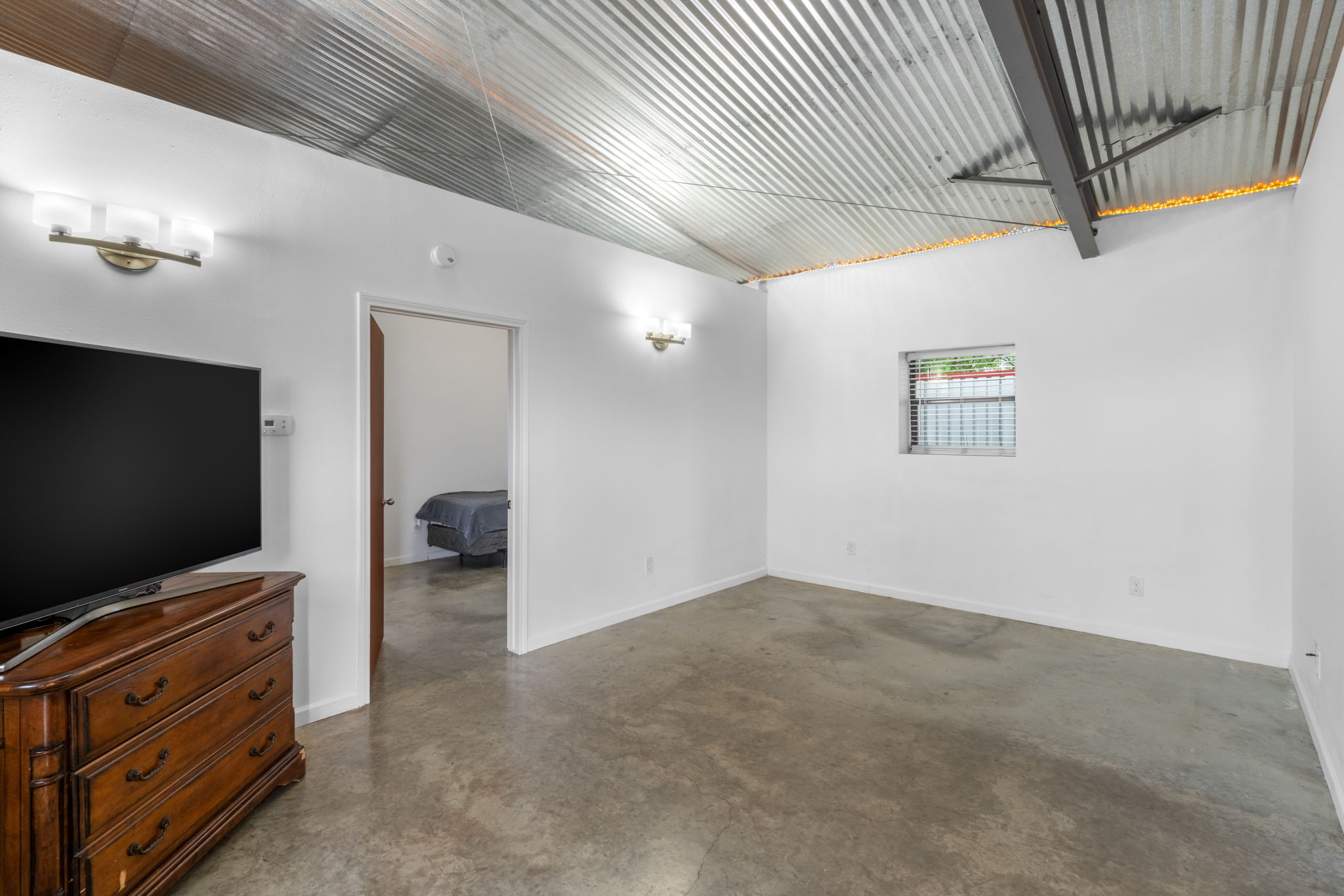 180 Henly Loop Dripping Springs, TX 78620 - Photo 30 of 38 a view of room with flat screen tv