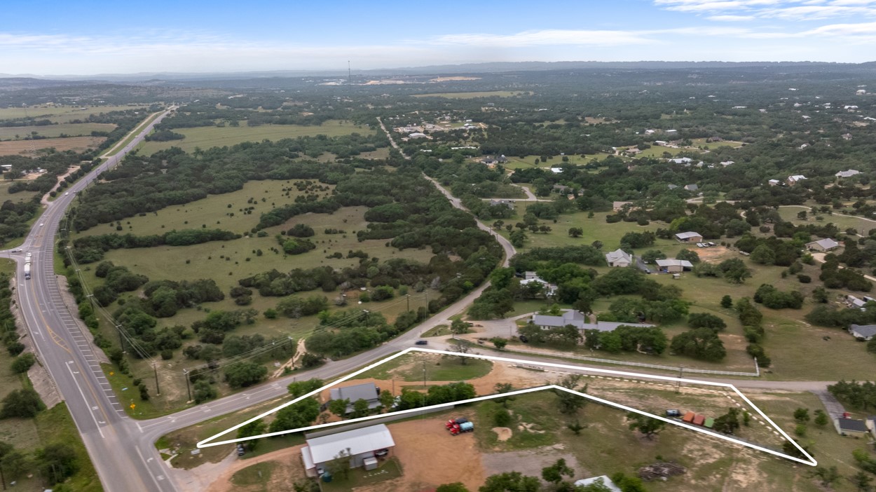 180 Henly Loop Dripping Springs, TX 78620 - Photo 3 of 38 an aerial view of residential houses with outdoor space