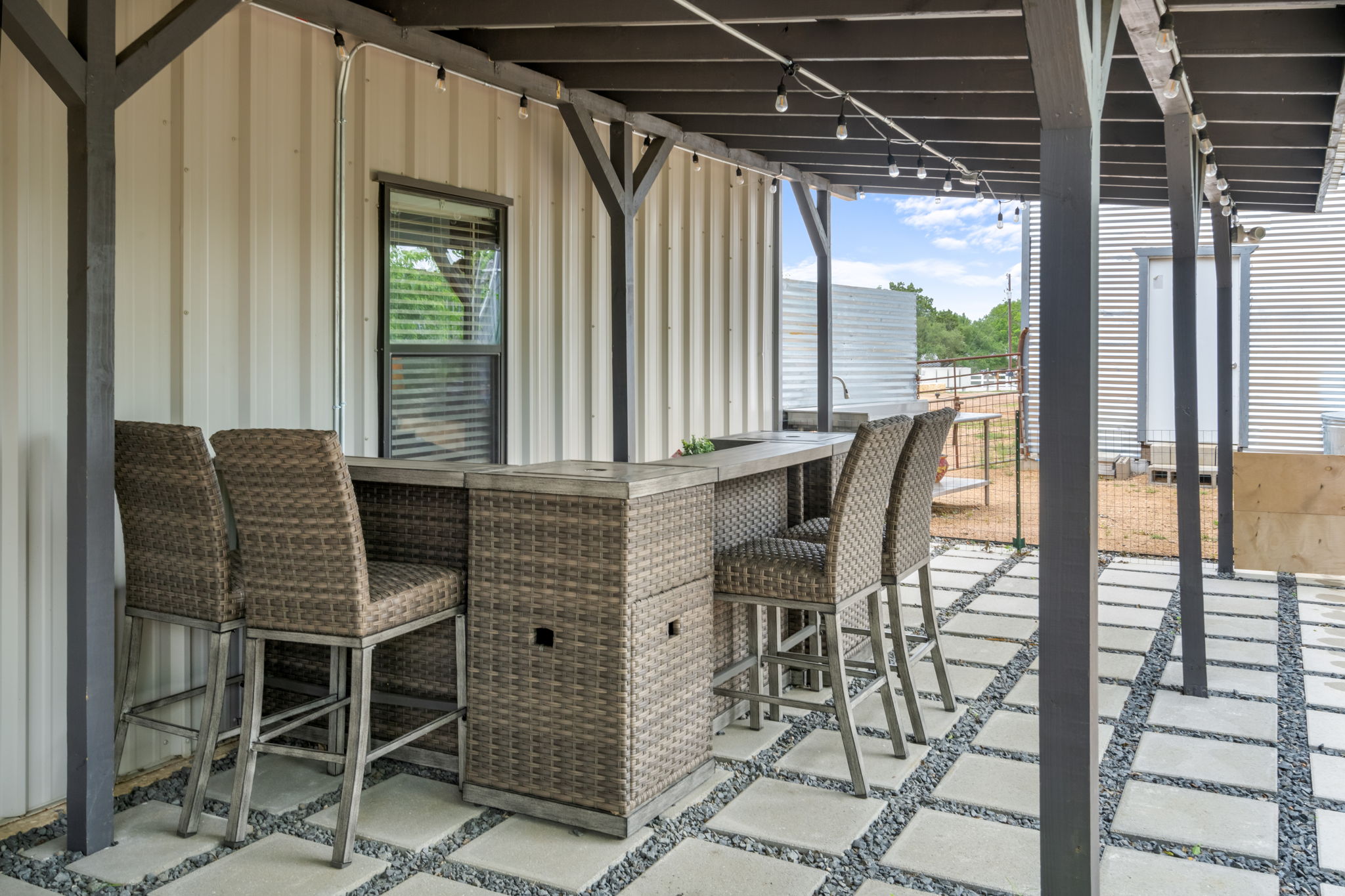 180 Henly Loop Dripping Springs, TX 78620 - Photo 38 of 38 a patio with table and chairs