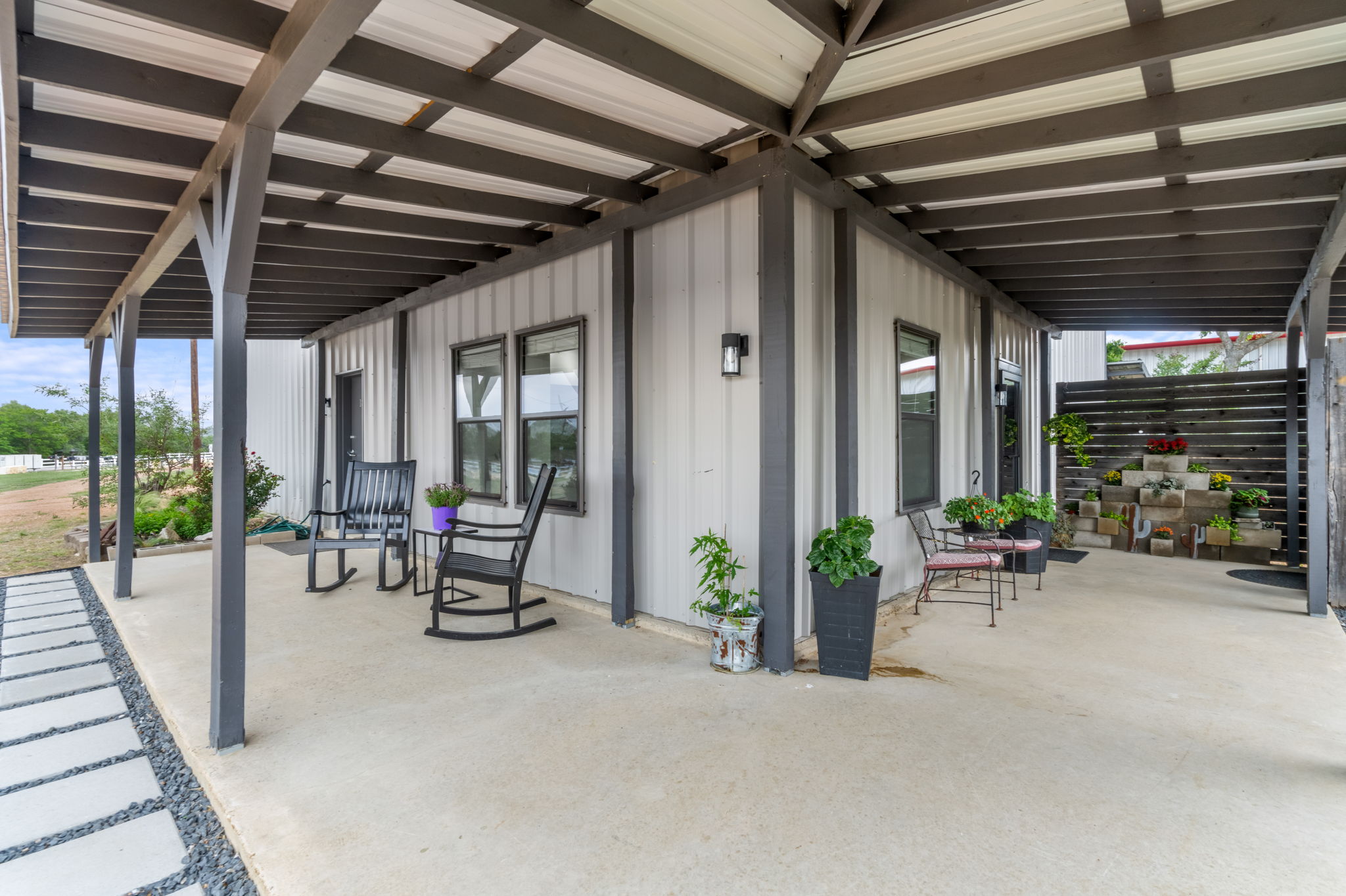 180 Henly Loop Dripping Springs, TX 78620 - Photo 8 of 38 a view of a porch with furniture