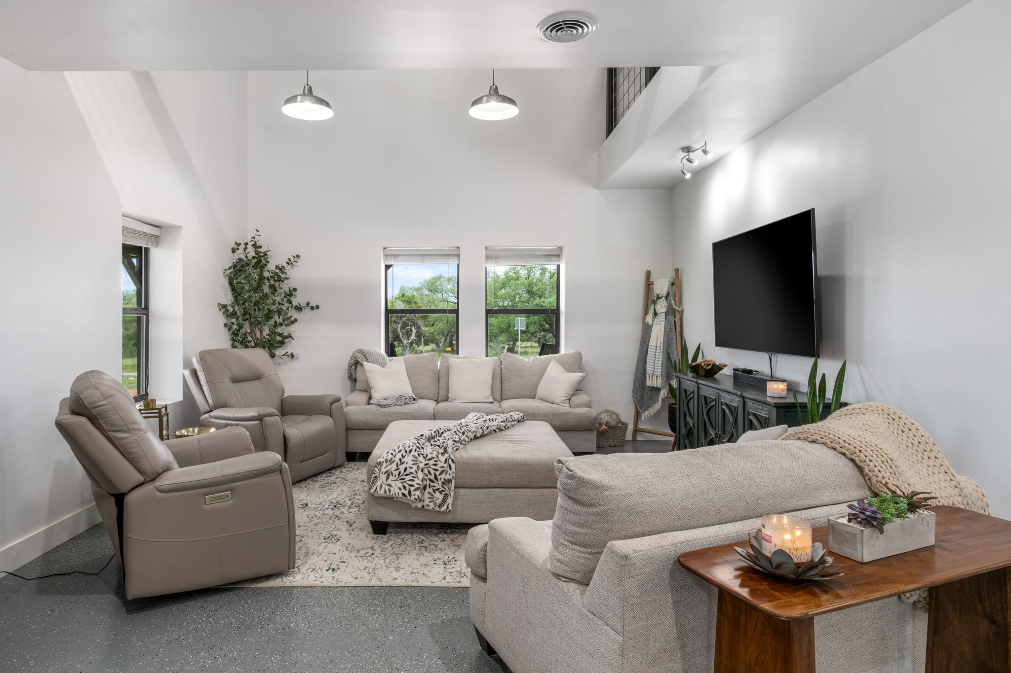180 Henly Loop Dripping Springs, TX 78620 - Photo 9 of 38 a living room with furniture and a flat screen tv