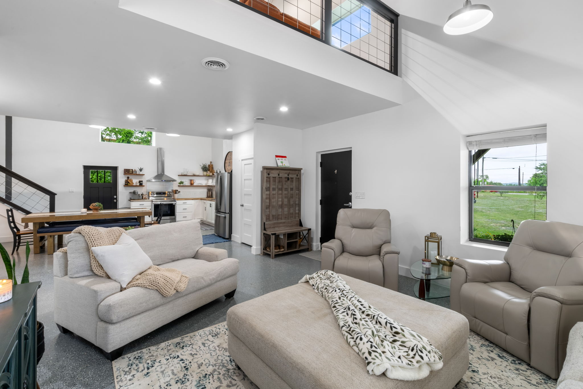 180 Henly Loop Dripping Springs, TX 78620 - Photo 10 of 38 a living room with furniture and a large window