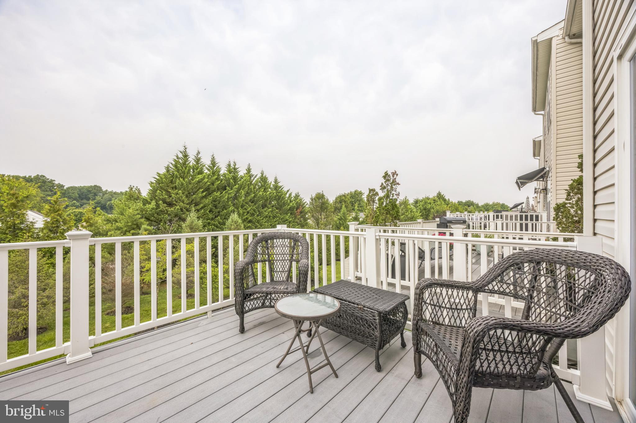 1072 Prime Place Sewell, NJ 08080 - Photo 23 of 36 a balcony with wooden floor outdoor seating and city view