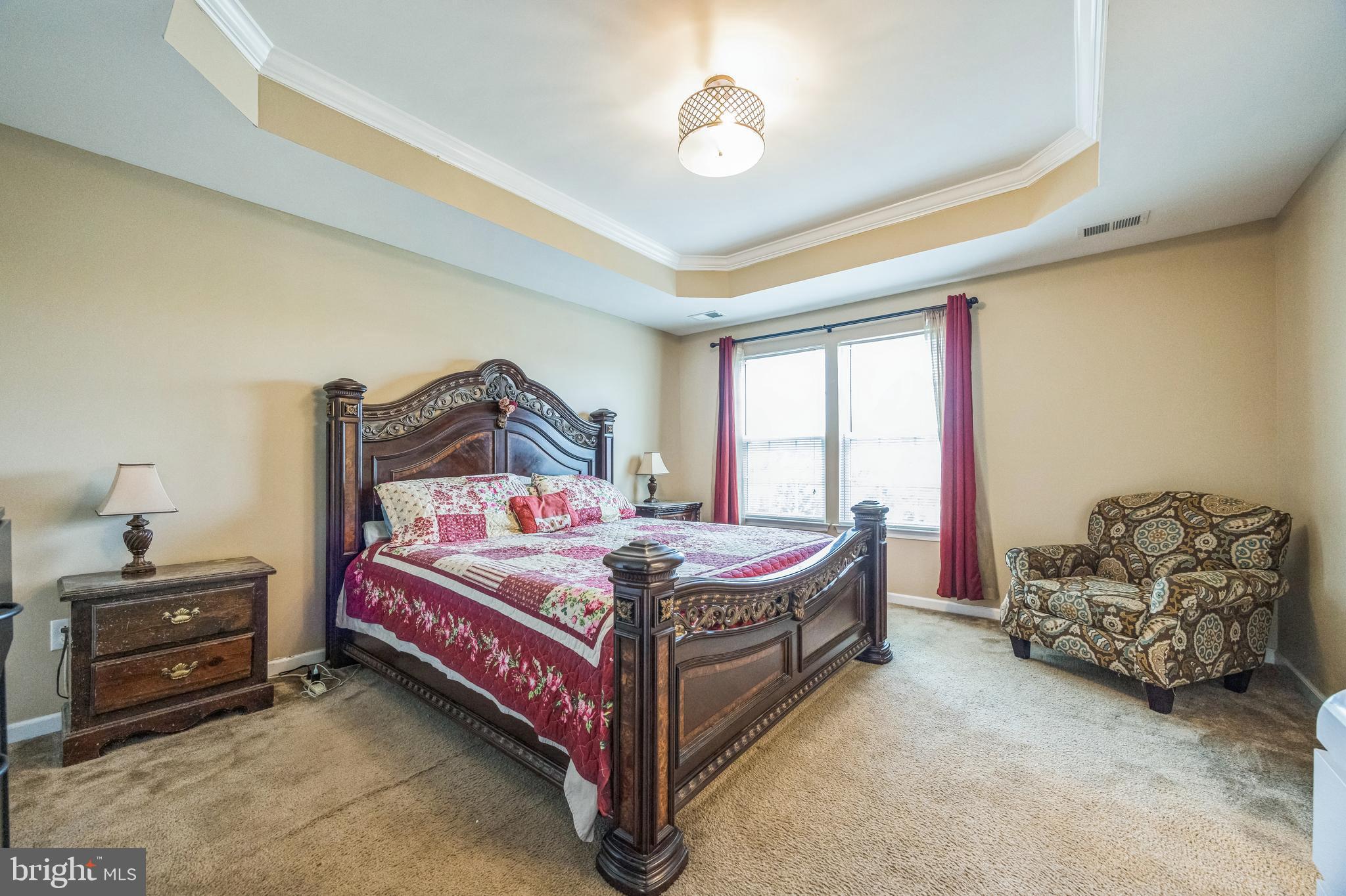 1072 Prime Place Sewell, NJ 08080 - Photo 24 of 36 a bedroom with a bed and a chandelier