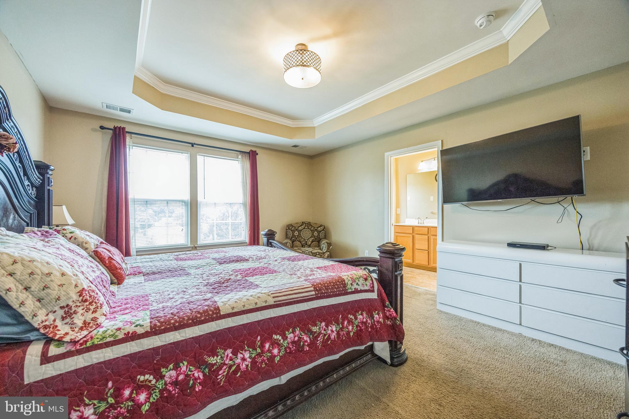 1072 Prime Place Sewell, NJ 08080 - Photo 26 of 36 a bedroom with a bed and a flat screen tv