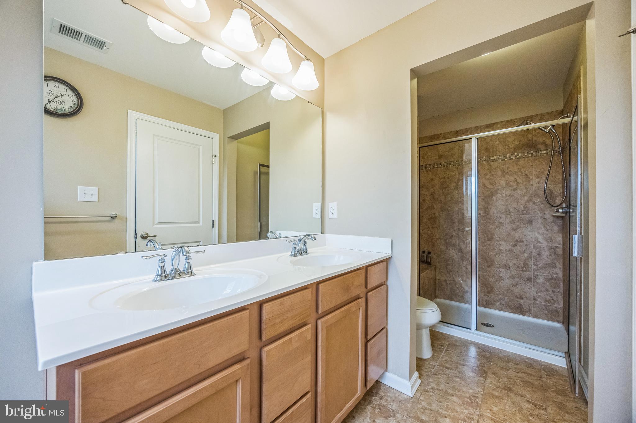 1072 Prime Place Sewell, NJ 08080 - Photo 28 of 36 a bathroom with a sink a toilet and shower