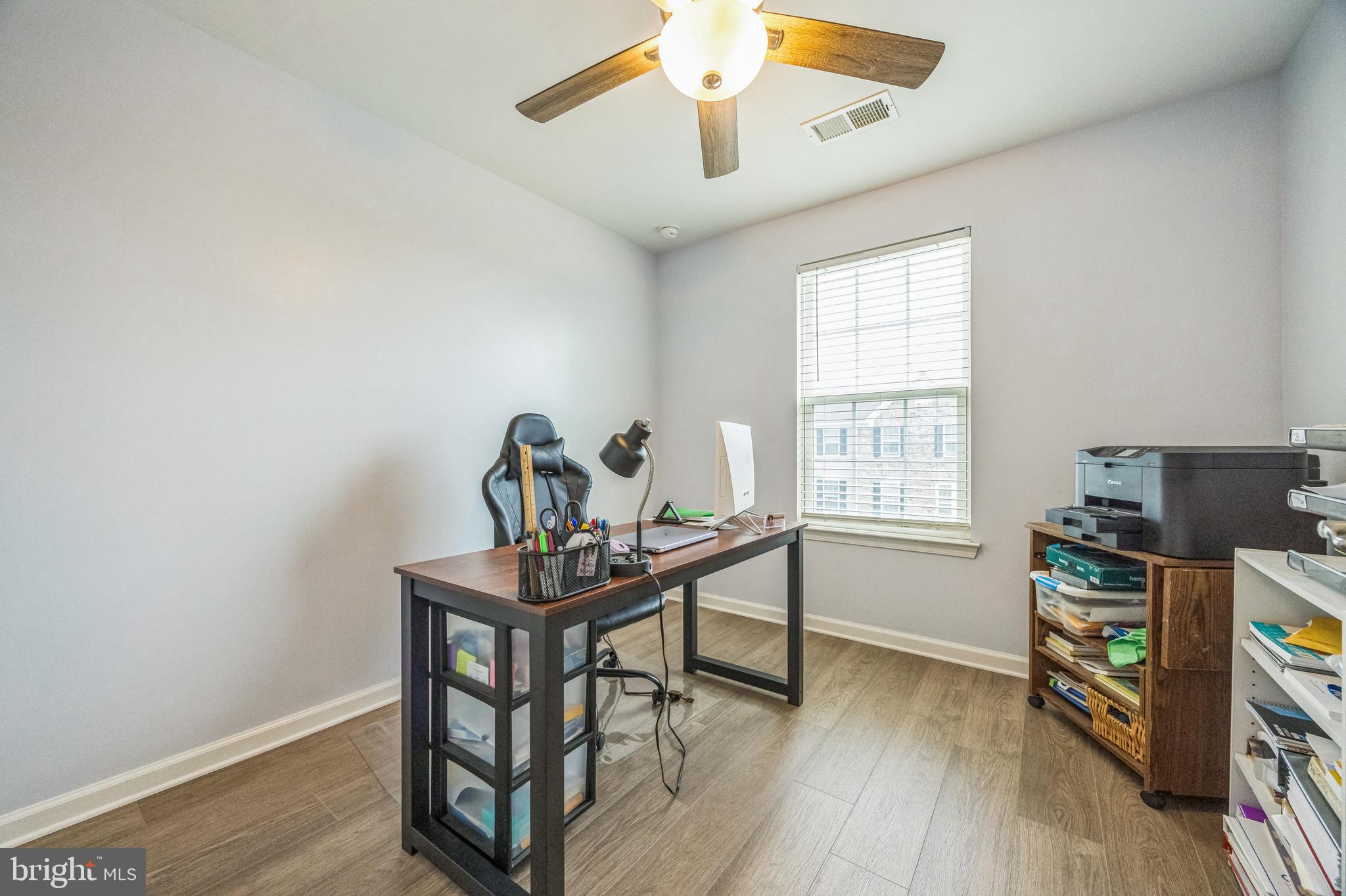 1072 Prime Place Sewell, NJ 08080 - Photo 29 of 36 a view of a workspace with furniture and wooden floor
