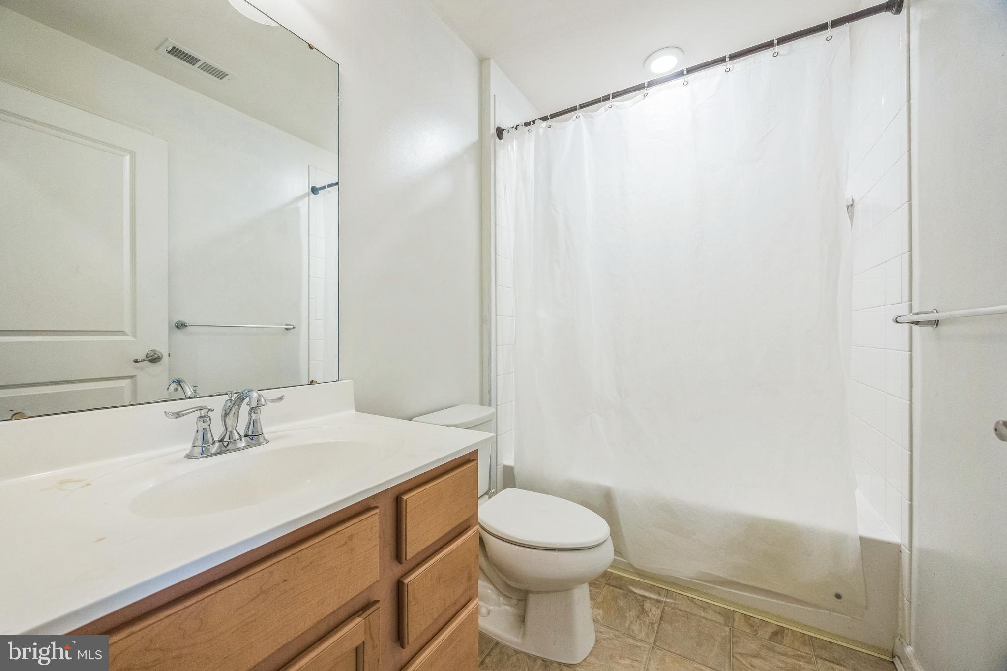 1072 Prime Place Sewell, NJ 08080 - Photo 33 of 36 a bathroom with a sink a toilet and shower