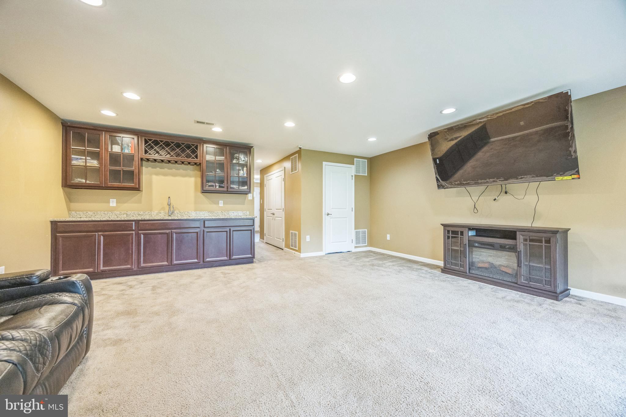 1072 Prime Place Sewell, NJ 08080 - Photo 6 of 36 a view of a livingroom with furniture flat screen tv and windows