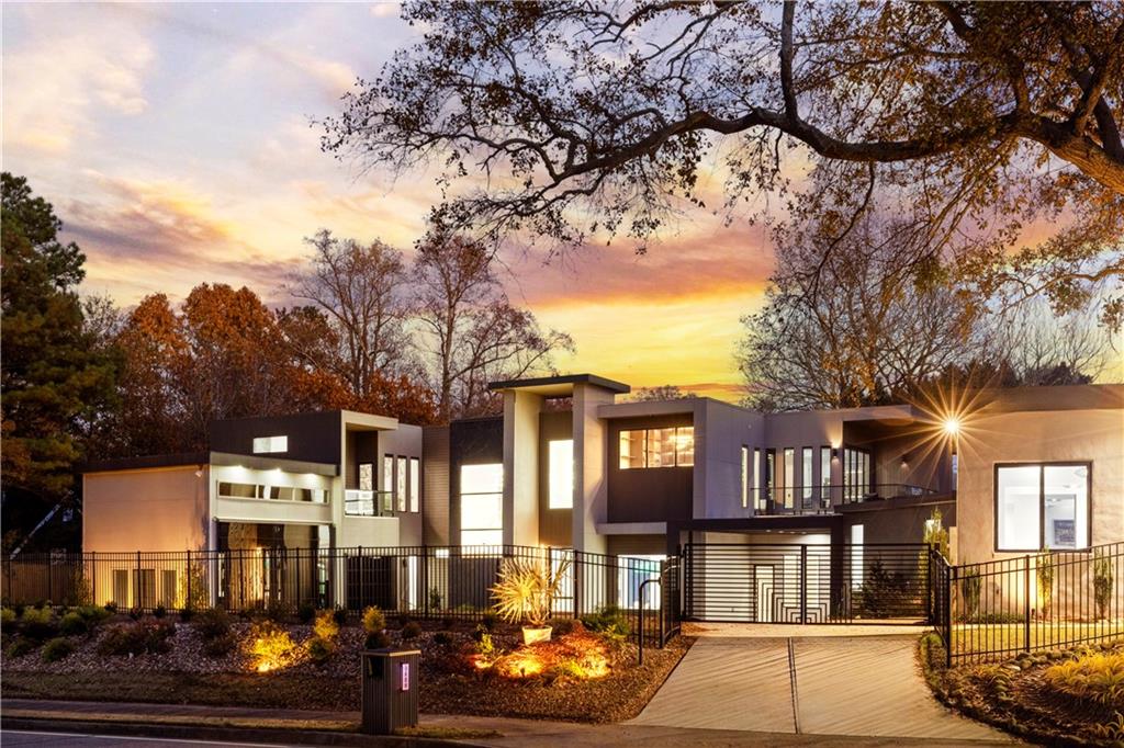 a front view of a residential apartment building with a yard