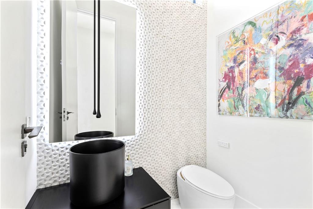 3600 Lower Roswell Road Marietta, GA 30068 - Photo 38 of 83 a bathroom with a toilet and a sink