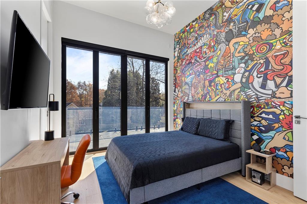 3600 Lower Roswell Road Marietta, GA 30068 - Photo 50 of 83 a bedroom with a bed and a lamp next to a large window