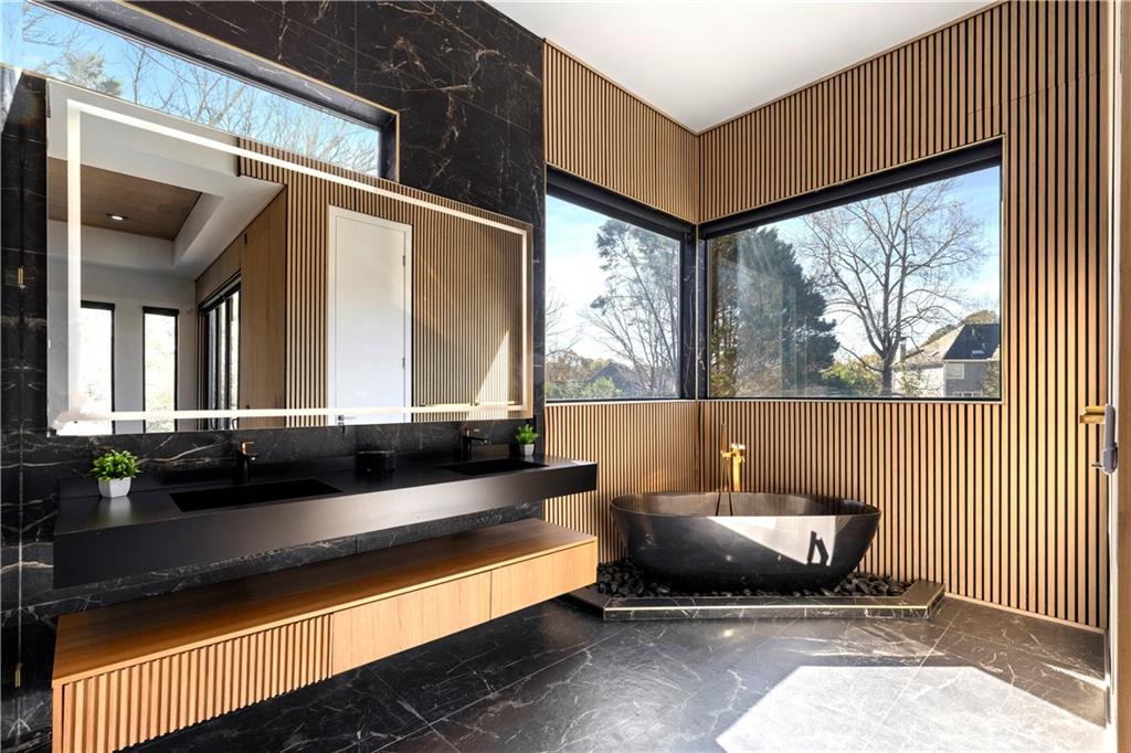 3600 Lower Roswell Road Marietta, GA 30068 - Photo 5 of 83 a living room with a couch and a large window