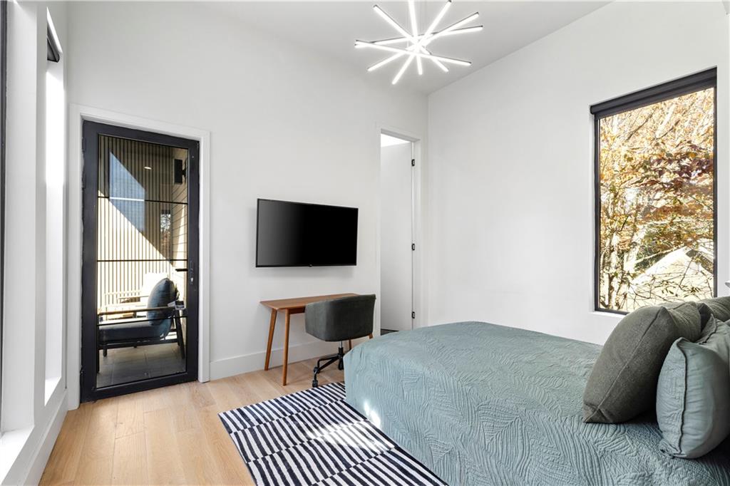 3600 Lower Roswell Road Marietta, GA 30068 - Photo 53 of 83 a bedroom with a bed and a flat screen tv