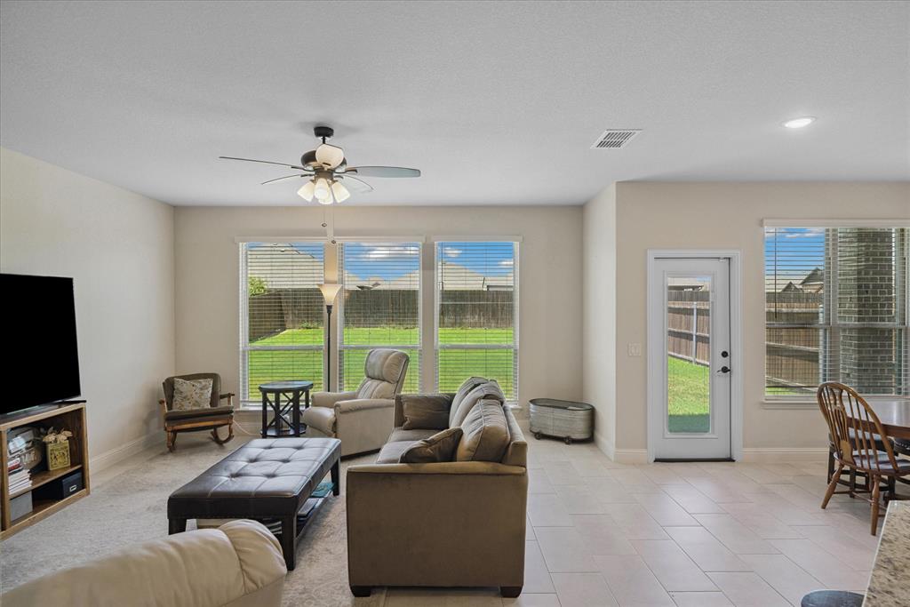 4102 Sublett Way Kaufman, TX 75142 - Photo 13 of 40 Living room with healthy amount of natural light, ceiling fan, and recessed lighting