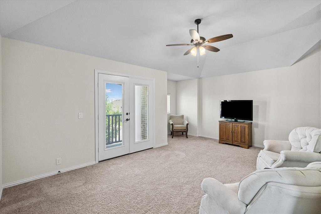 4102 Sublett Way Kaufman, TX 75142 - Photo 21 of 40 Living area featuring light colored carpet, ceiling fan, and lofted ceiling