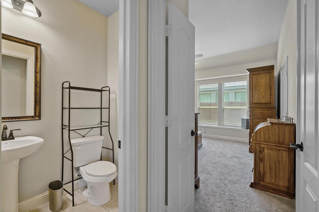 4102 Sublett Way Kaufman, TX 75142 - Photo 29 of 40 Bathroom with toilet and baseboards