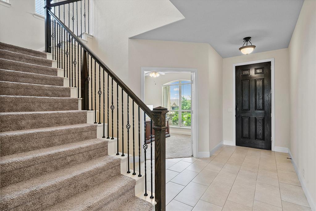 4102 Sublett Way Kaufman, TX 75142 - Photo 6 of 40 Foyer featuring stairway, light tile patterned floors, and a ceiling fan