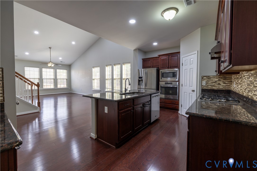 4801 Shellbark Court Glen Allen, VA 23059 - Photo 11 of 43 a kitchen with stainless steel appliances granite countertop wooden floors and view