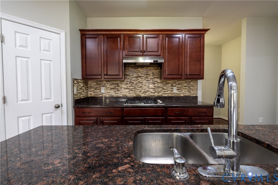 4801 Shellbark Court Glen Allen, VA 23059 - Photo 13 of 43 a kitchen with a refrigerator and cabinets