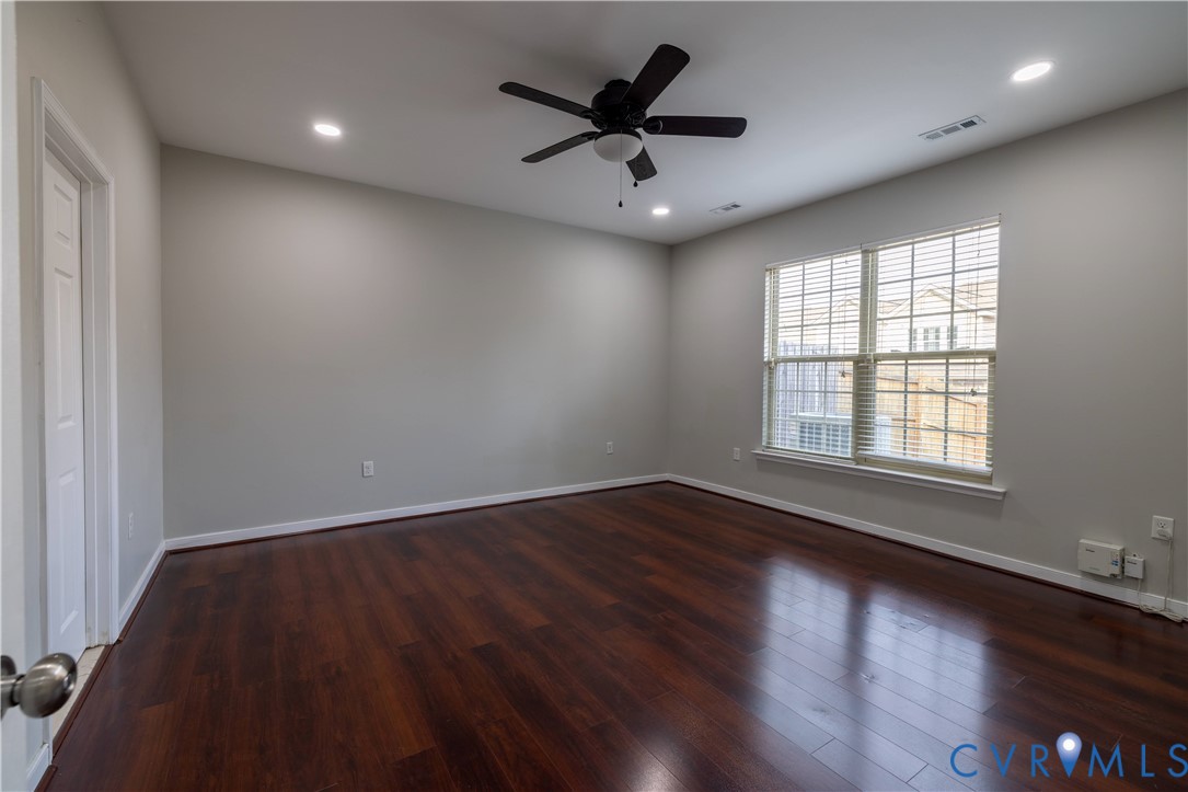 4801 Shellbark Court Glen Allen, VA 23059 - Photo 18 of 43 an empty room with wooden floor and windows