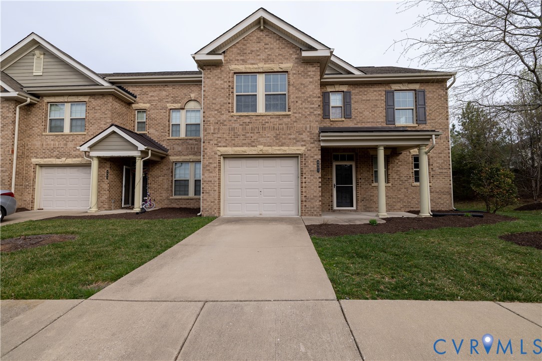 4801 Shellbark Court Glen Allen, VA 23059 - Photo 2 of 43 a front view of a house with a yard and garage