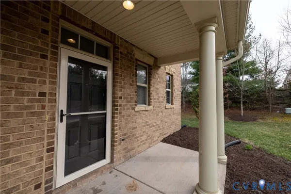 a view of a brick house with a large space