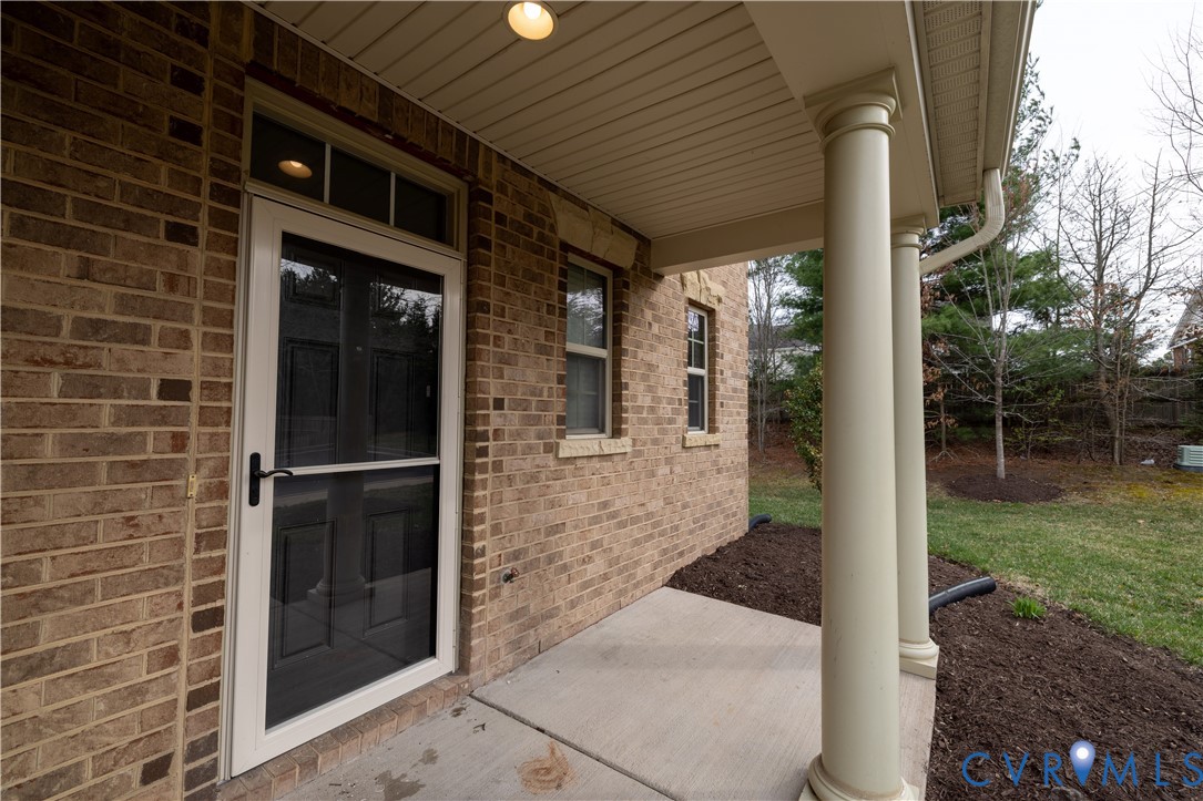 4801 Shellbark Court Glen Allen, VA 23059 - Photo 6 of 43 a view of a brick house with a large space