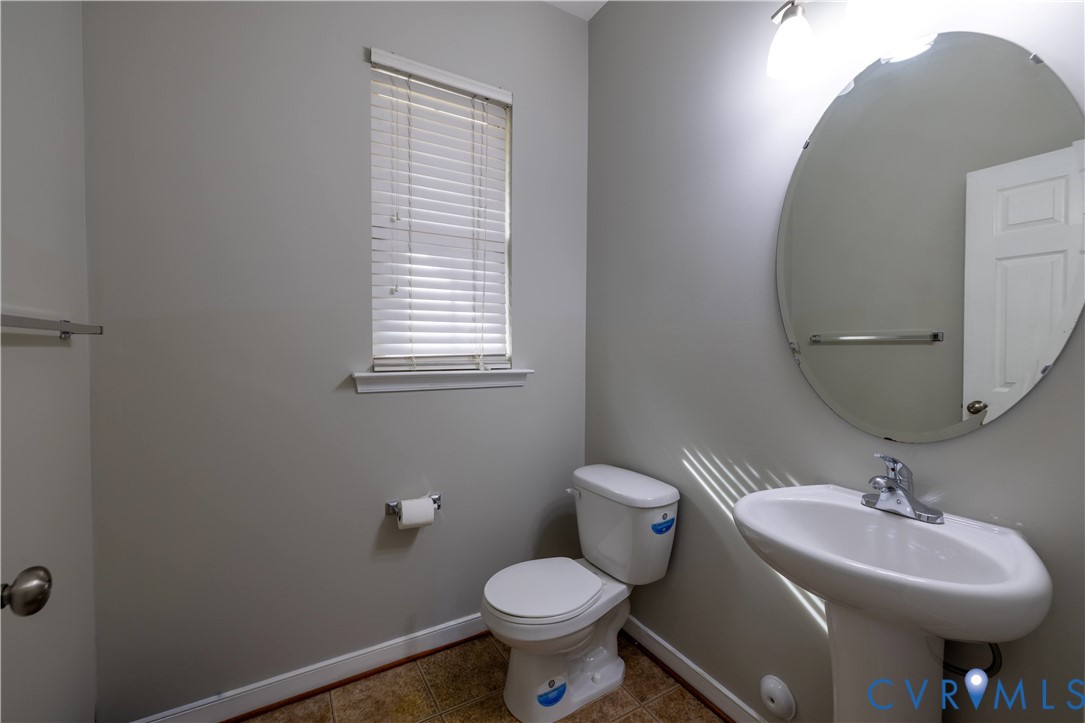 4801 Shellbark Court Glen Allen, VA 23059 - Photo 9 of 43 a bathroom with a toilet sink and mirror