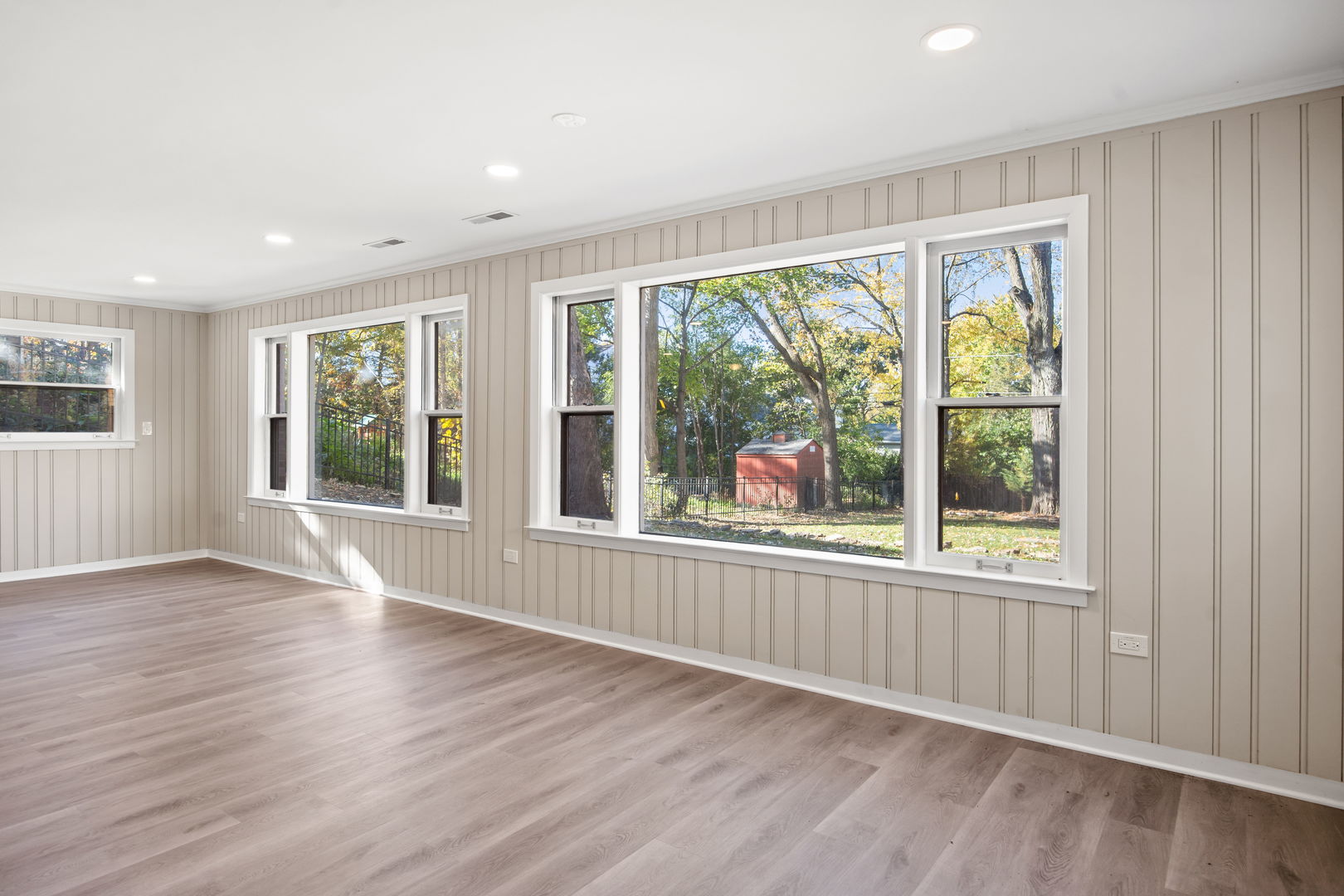 914 Brook Street Elgin, IL 60120 - Photo 11 of 21 an empty room with wooden floor and windows