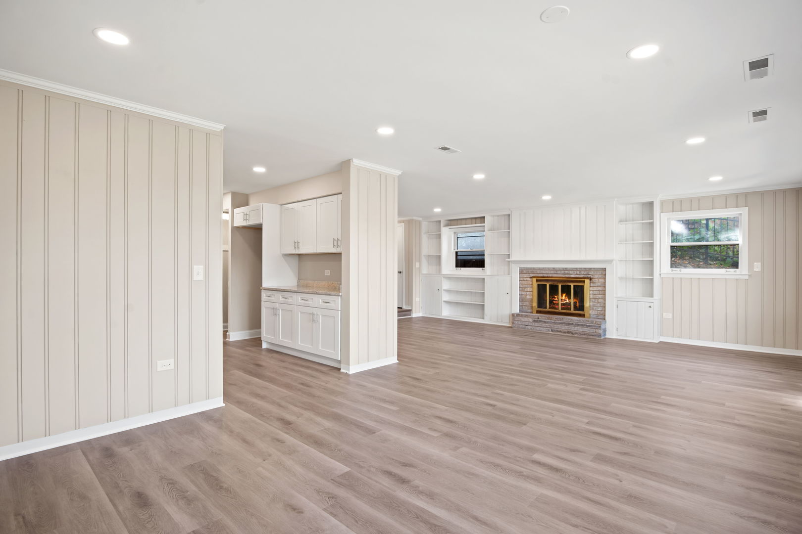 914 Brook Street Elgin, IL 60120 - Photo 12 of 21 an empty room with wooden floor and windows