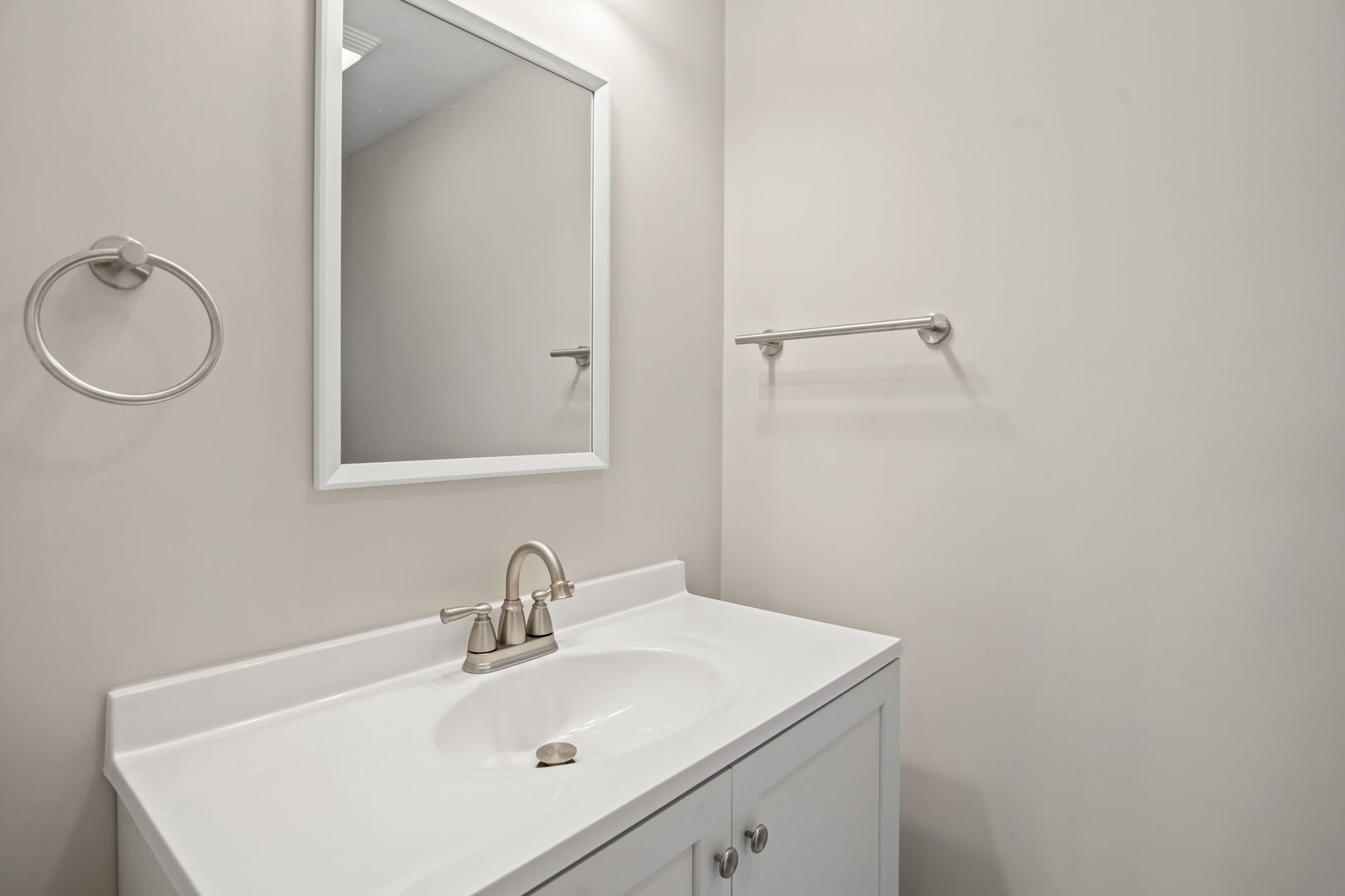 914 Brook Street Elgin, IL 60120 - Photo 16 of 21 a bathroom with a sink and mirror