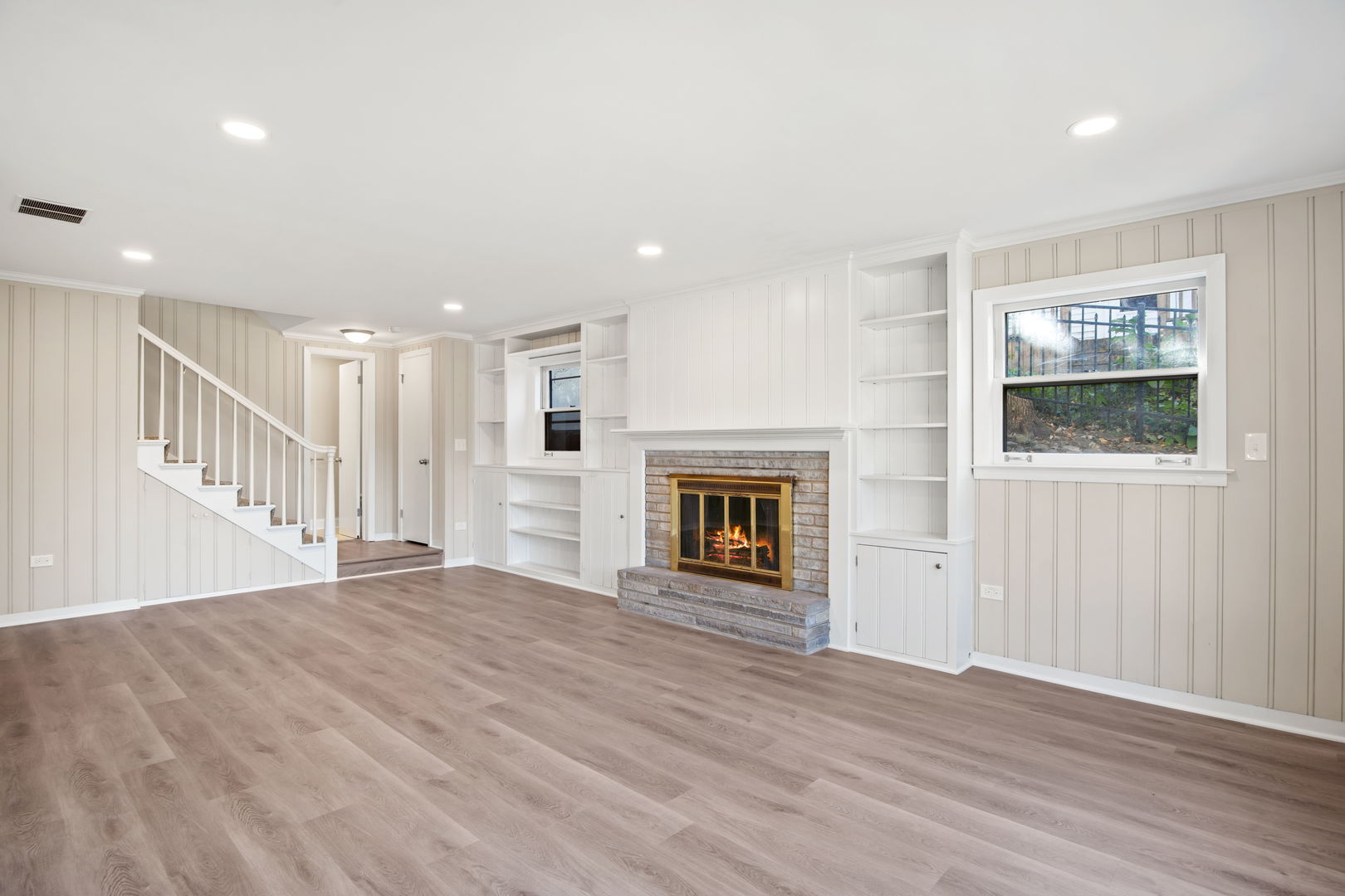 914 Brook Street Elgin, IL 60120 - Photo 8 of 21 a view of an empty room with wooden floor and a window