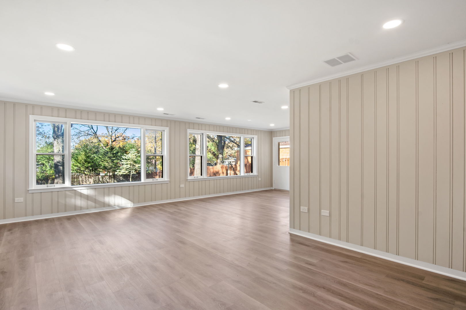 914 Brook Street Elgin, IL 60120 - Photo 10 of 21 an empty room with wooden floor and windows