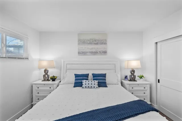 a bedroom with a bed and a fireplace