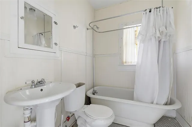 wooden floor with white cabinets
