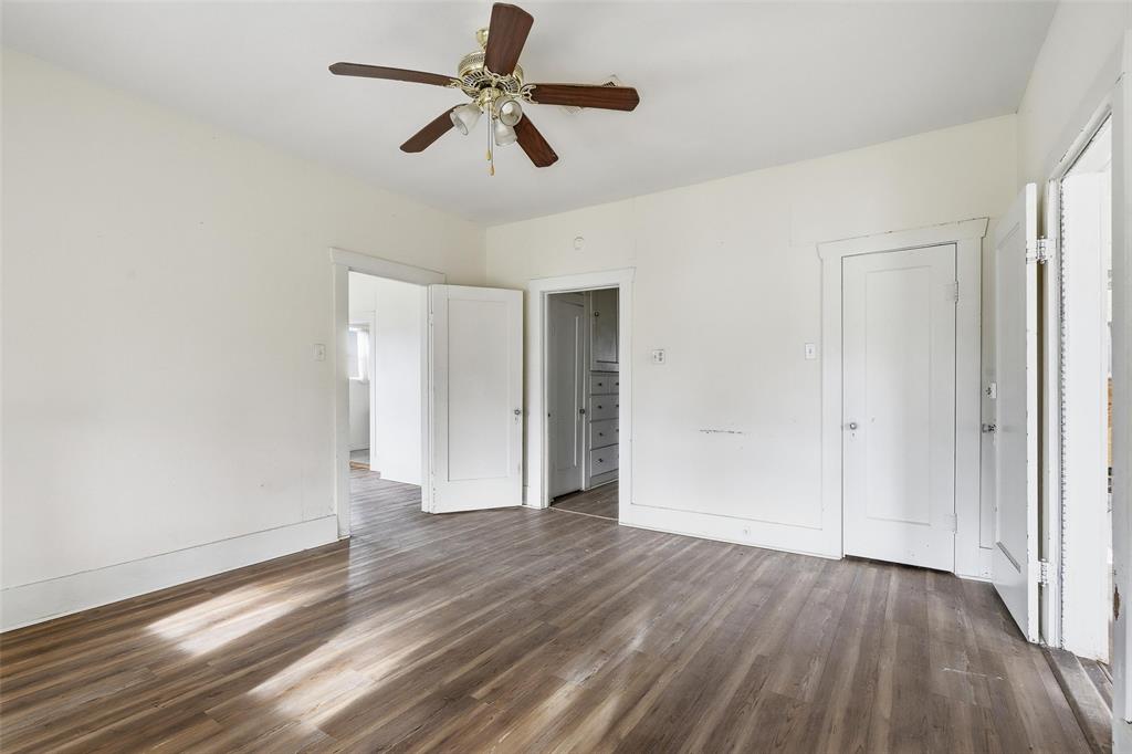 403 East Morgan Street Meridian, TX 76665 - Photo 28 of 40 wooden floor in an empty room with a window