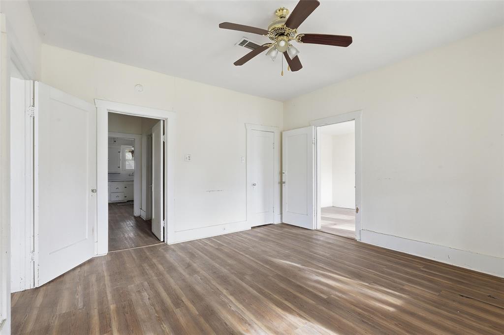 403 East Morgan Street Meridian, TX 76665 - Photo 29 of 40 a view of empty room with wooden floor