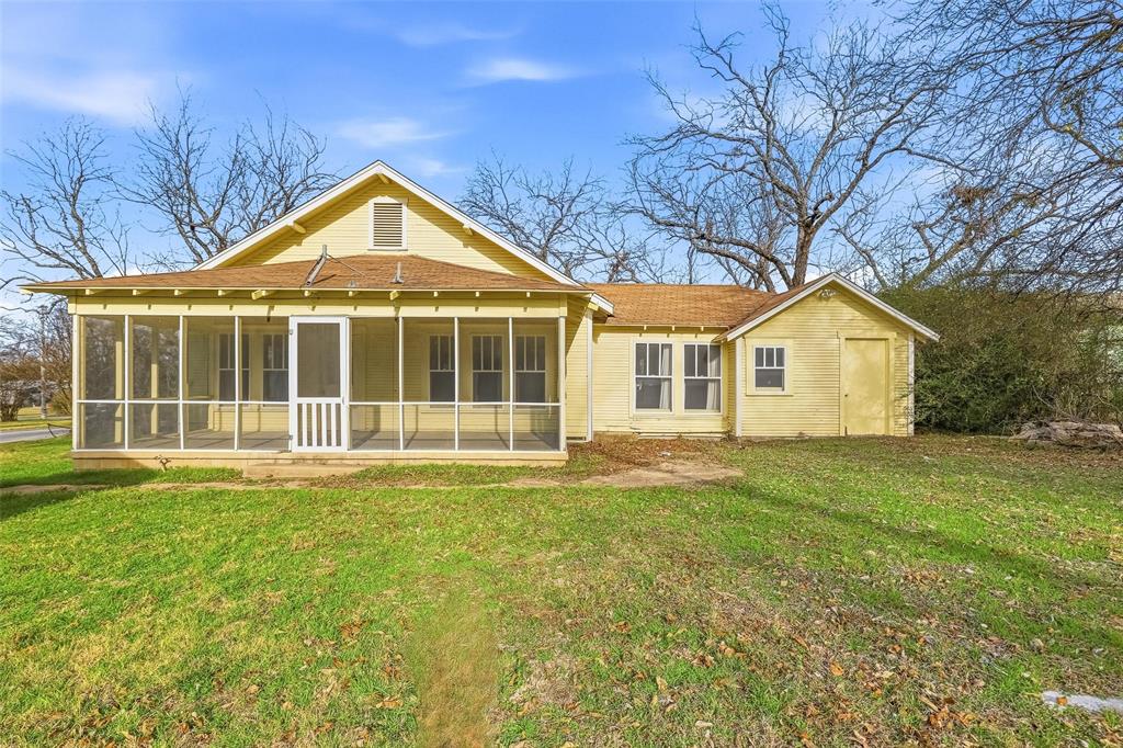 403 East Morgan Street Meridian, TX 76665 - Photo 3 of 40 a view of a house with a yard