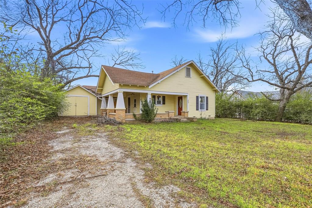 403 East Morgan Street Meridian, TX 76665 - Photo 7 of 40 a view of a house with a yard