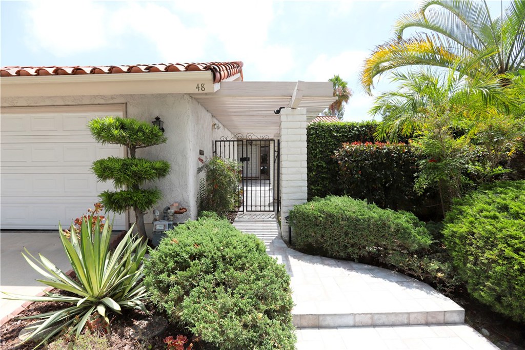 48 Cedar Tree Lane Irvine, CA 92612 - Photo 1 of 52 a view of balcony with furniture and flowers