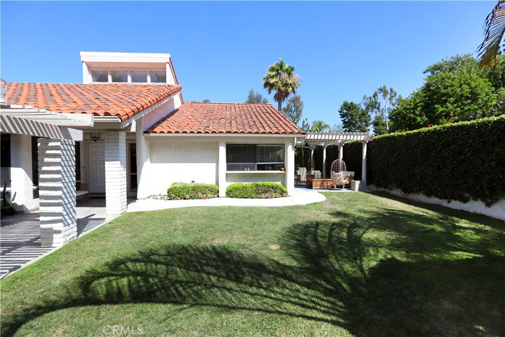 48 Cedar Tree Lane Irvine, CA 92612 - Photo 2 of 52 a front view of a house with garden