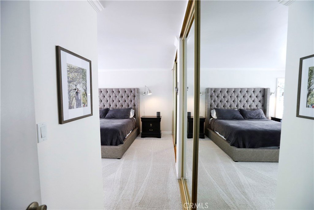 48 Cedar Tree Lane Irvine, CA 92612 - Photo 24 of 52 a bedroom with a large bed and a couch