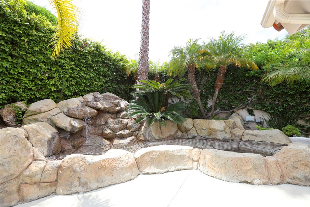 48 Cedar Tree Lane Irvine, CA 92612 - Photo 32 of 52 a view of a backyard of white house