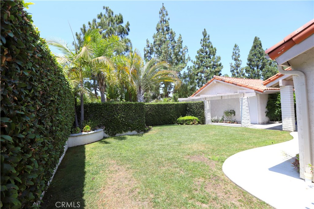 48 Cedar Tree Lane Irvine, CA 92612 - Photo 38 of 52 a front view of a house with garden