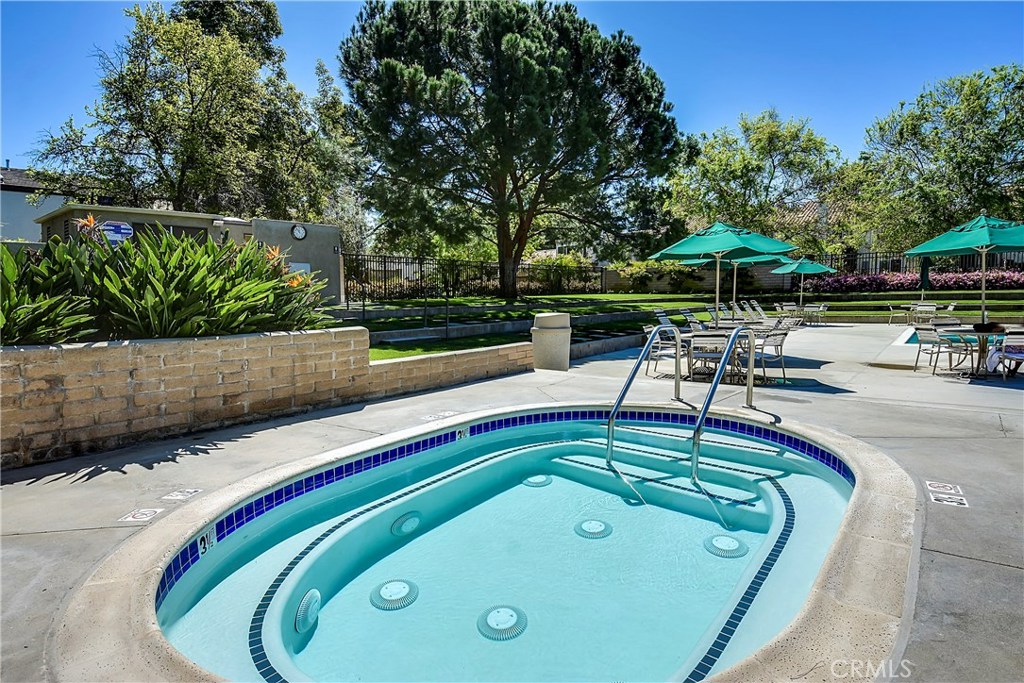 48 Cedar Tree Lane Irvine, CA 92612 - Photo 42 of 52 a swimming pool with outdoor seating and trees