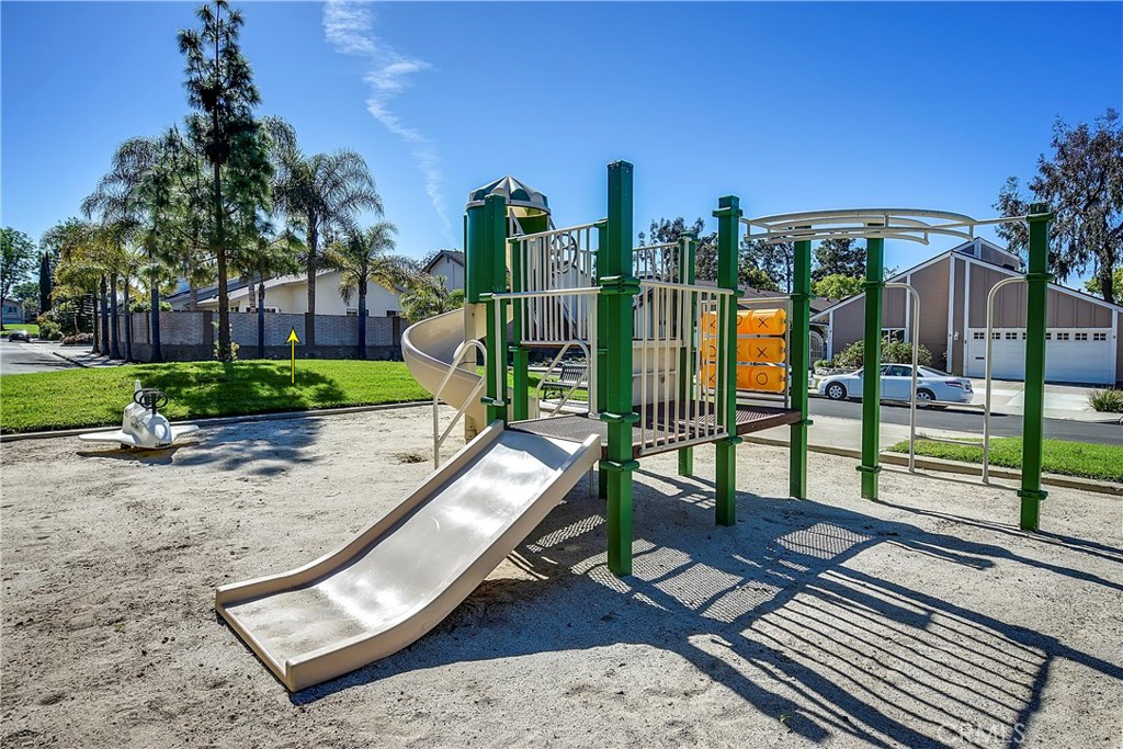 48 Cedar Tree Lane Irvine, CA 92612 - Photo 44 of 52 a view of a park with swings and slides