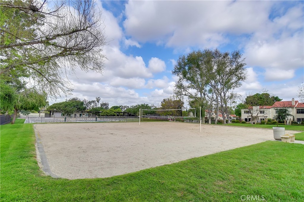 48 Cedar Tree Lane Irvine, CA 92612 - Photo 46 of 52 a view of a lake with houses in the background